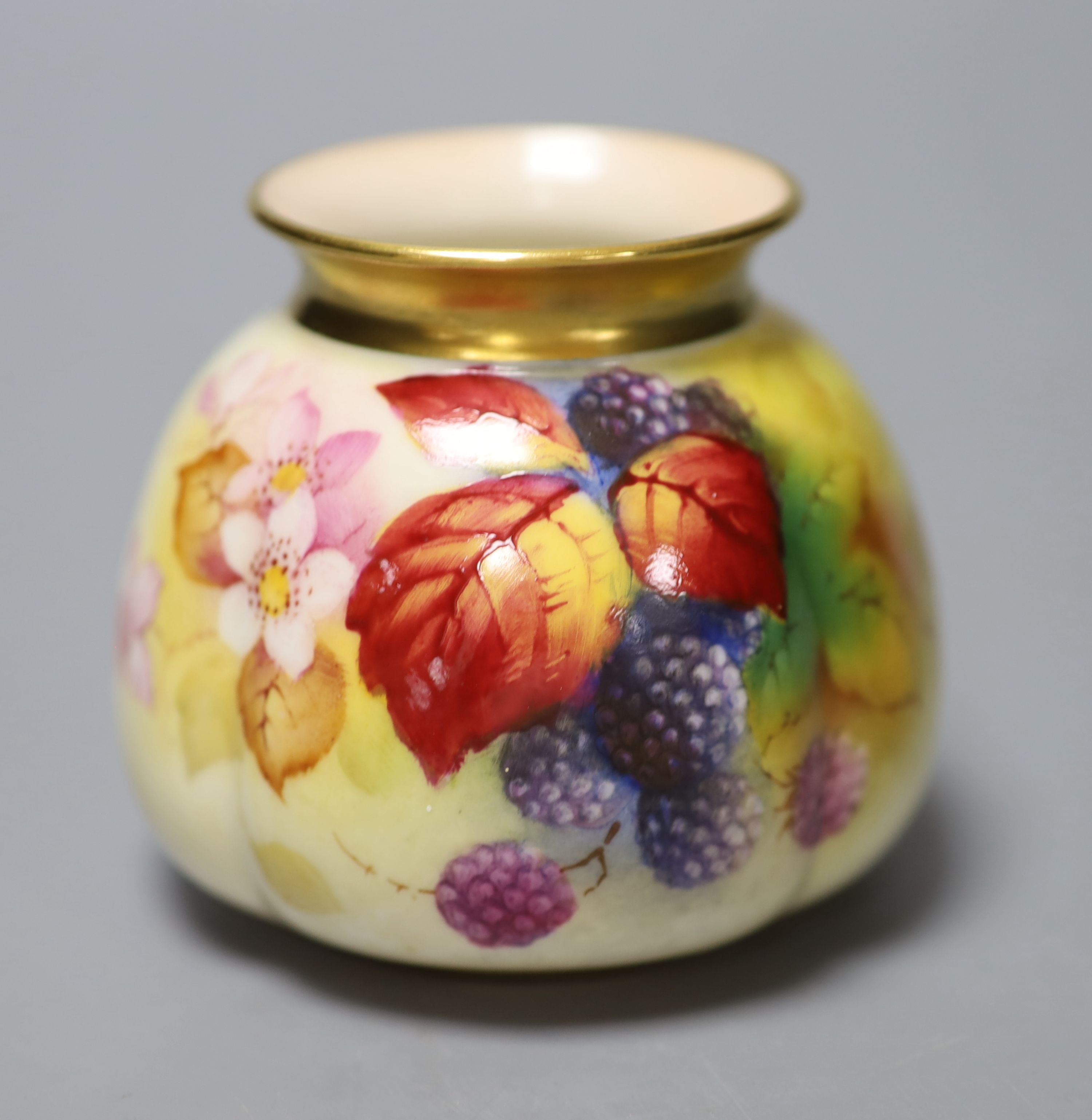 A Royal Worcester moulded vase shape 158H painted with autumnal leaves and berries by K. Blake, signed date, code 1939, height 7.5cm